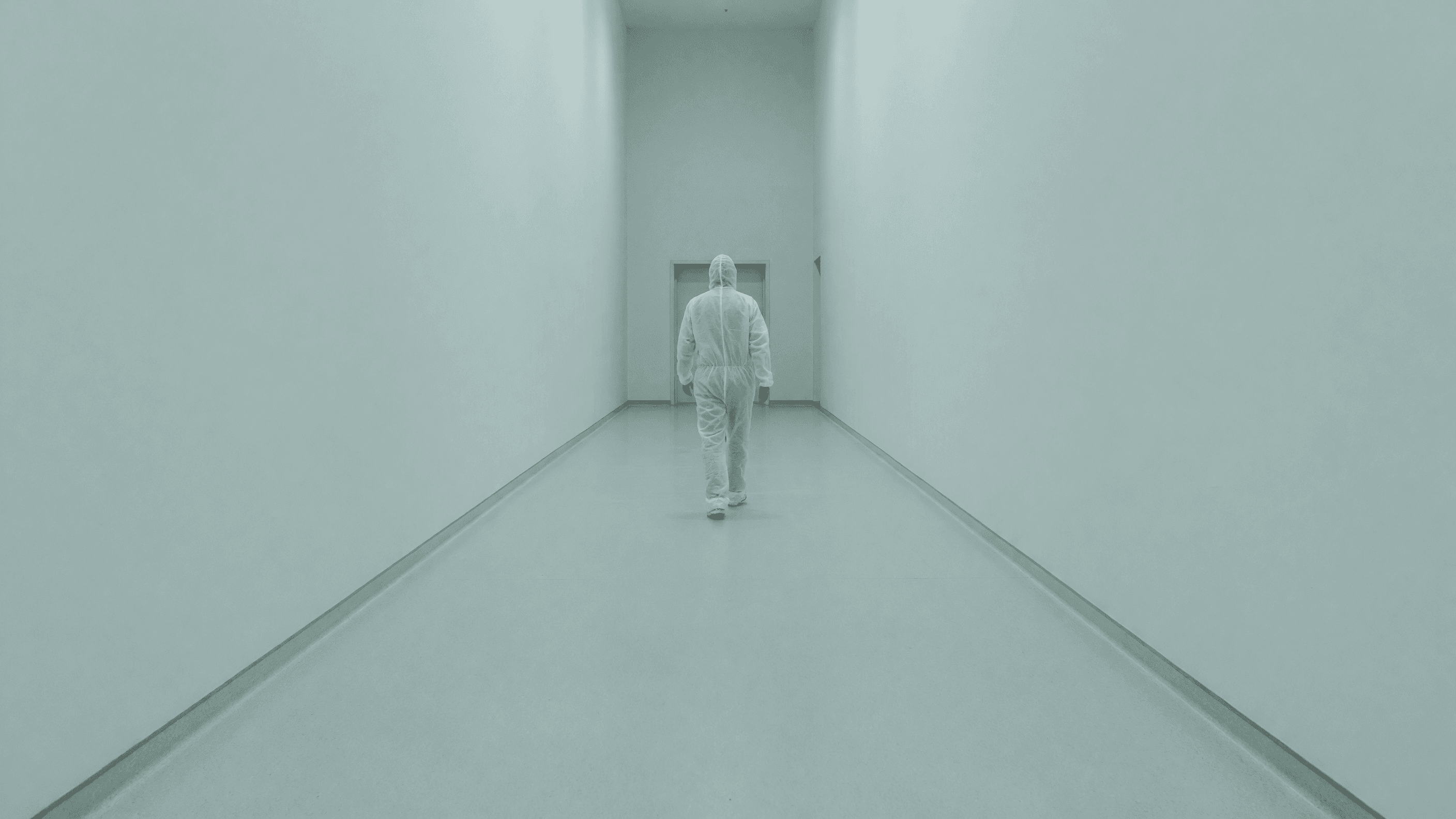 A plant worker in white coveralls walks a long clean corridor — the NRC's ALARA rewrite leads today's brief. Illustration: NNN