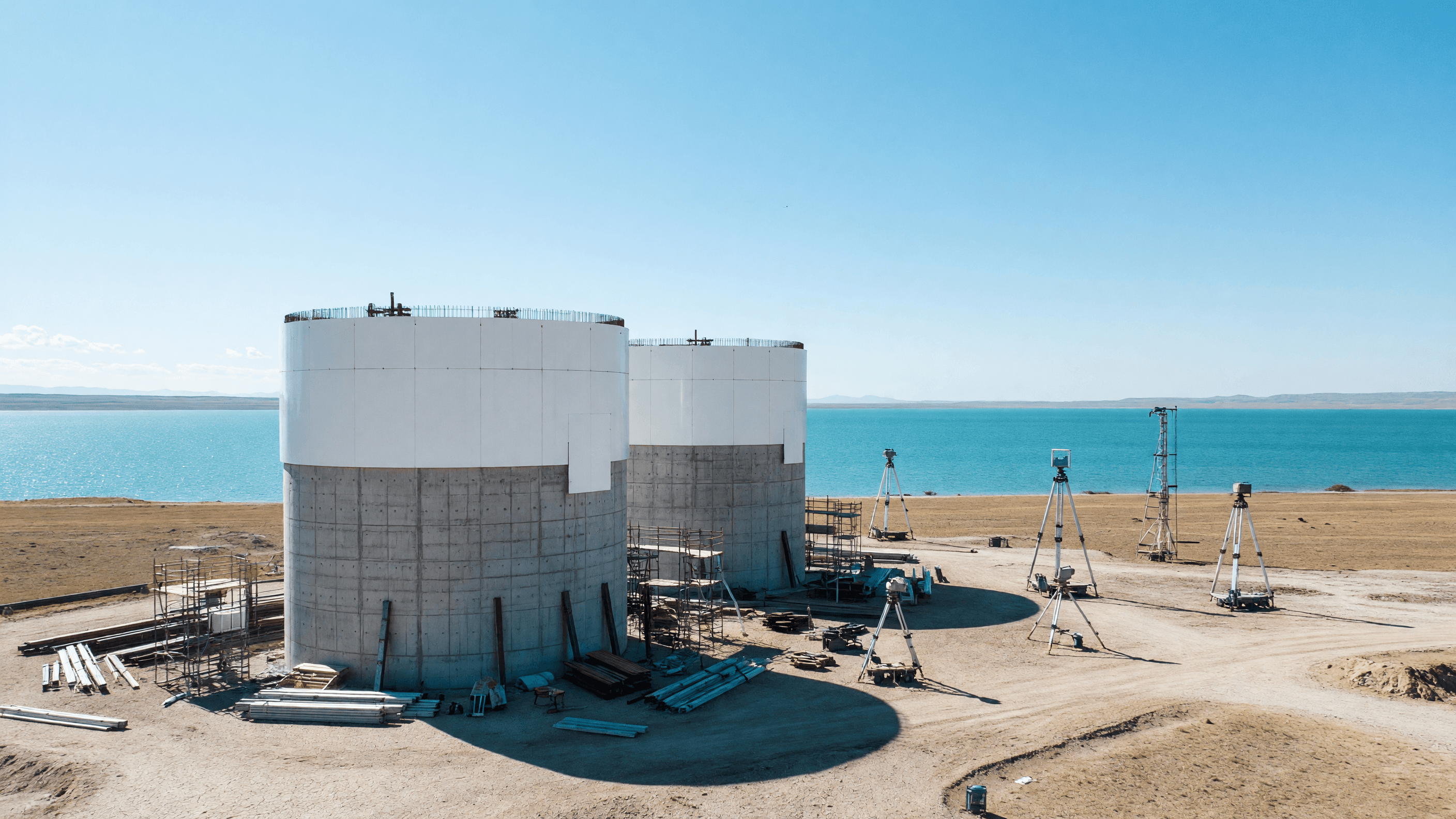 Two VVER-1200 reactor containment buildings under early construction on the arid western shore of Lake Balkhash in Kazakhstan, the site of the Balkhash nuclear plant EPC contract signed by Rosatom. Illustration: NNN