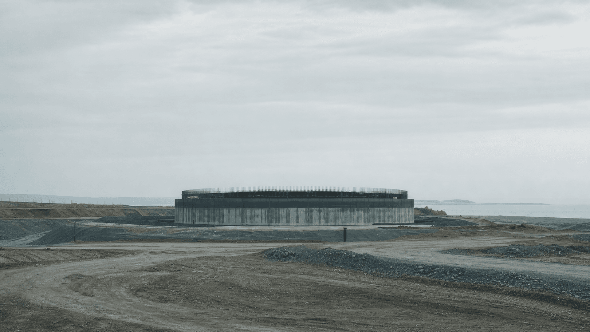 A quiet nuclear construction site with an unfinished circular reactor foundation, representing China's approval of eight new reactors across four projects. Illustration: NNN.