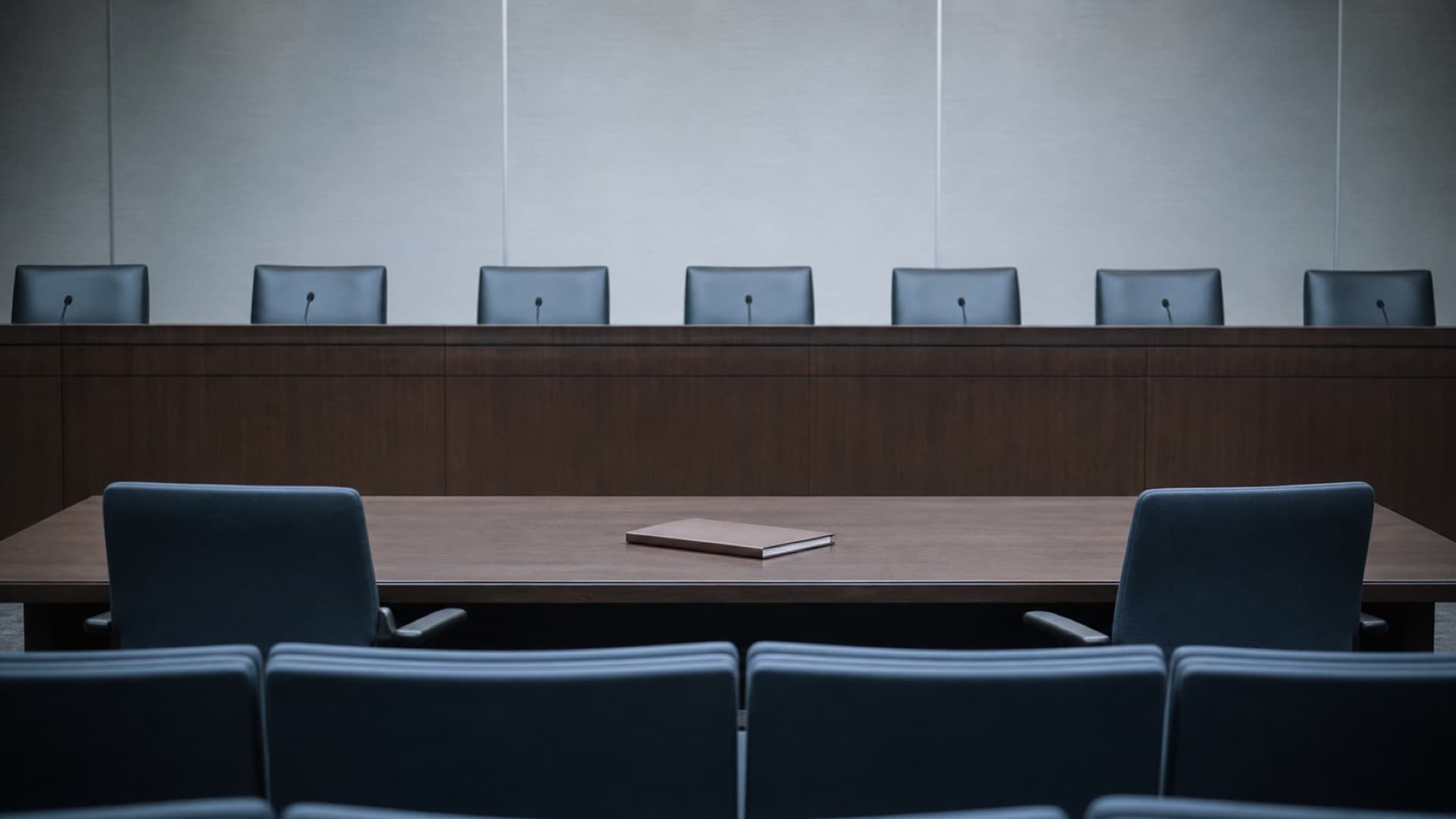 An empty state utility commission hearing room represents the public review and procurement process for new nuclear power. Illustration: NNN
