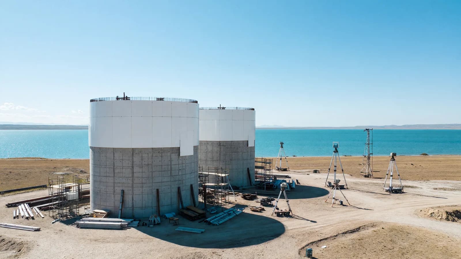 Two VVER-1200 reactor containment buildings under early construction on the arid western shore of Lake Balkhash in Kazakhstan, the site of the Balkhash nuclear plant EPC contract signed by Rosatom. Illustration: NNN